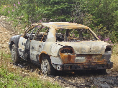 Burnt out vehicle left in the woods