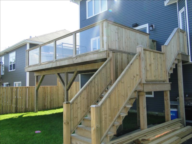 deck with stairs attached to a house