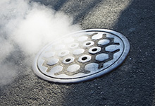 Image of manhole with non-toxic water vapour