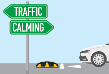 Image of a road with a white car approaching a speed bump, a street sign reads 'Traffic Calming'
