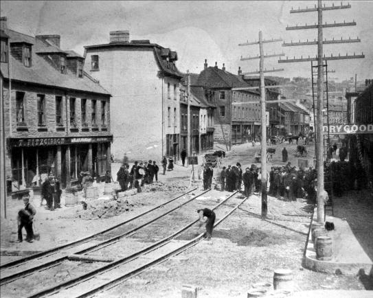 Laying street car tracks on Water Street in 1899