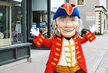 Admiral Johns mascot of St. John's Days in front of the Visitor Information Centre at 348 Water Street