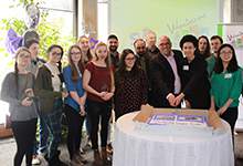 2017 volunteer award winners cut reception cake
