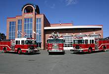 Image of three SJRFD Fire Trucks parked at Central Fire Station in St. John's