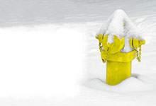 yellow fire hydrant surrounded by snow