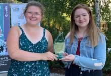 Sarah and Kacey accept the 'Building Healthy Communities Award on behalf of Fridays For Future