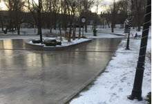 Image shows the Loop at Bannerman Park covered in ice with snow on the ground