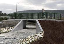 Image of a concrete structure with a walkway over a river in St. John's