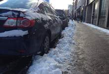 image of vehicle parked on a street with snow