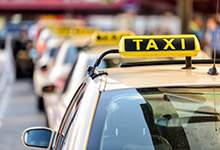 Image of a Taxis lined up at a Taxi stand