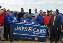 Representatives from the Toronto Blue Jays, St. John's Minor Baseball Association and the City of St. John's holding a new sign for the Airport Heights Baseball Field.