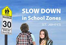 Children next to School Zone sign where drivers must slow down