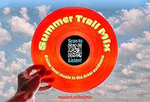 image of a hand holding a red record that says "Summer Trail Mix" with blue sky in the background