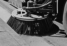 Close up sweeper brush of street cleaning machine